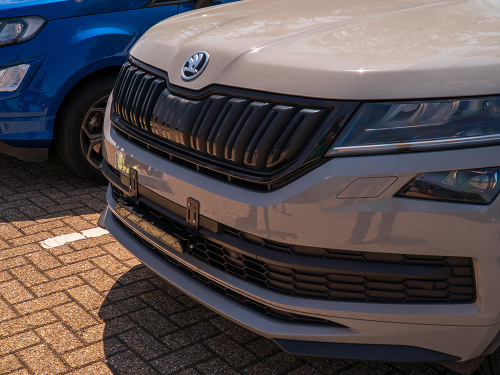 LED light bar mounted below a license plate