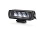 Angled view of the lamp face highlighting the depth of the housing and the contours of the lens and outer casing.